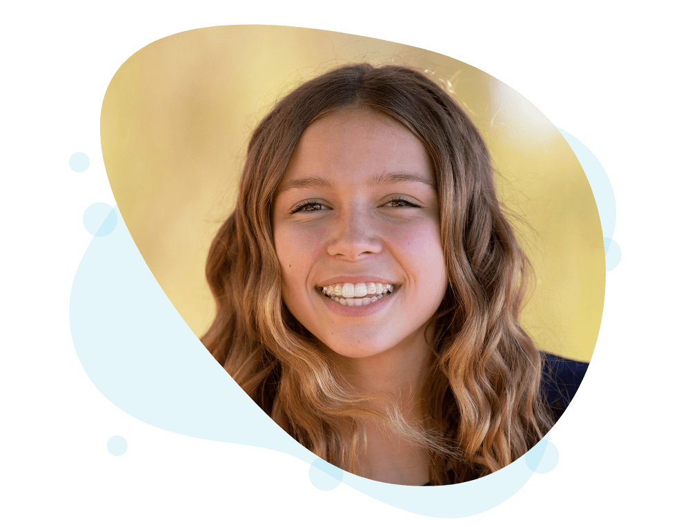 Young woman smiling with Invisalign